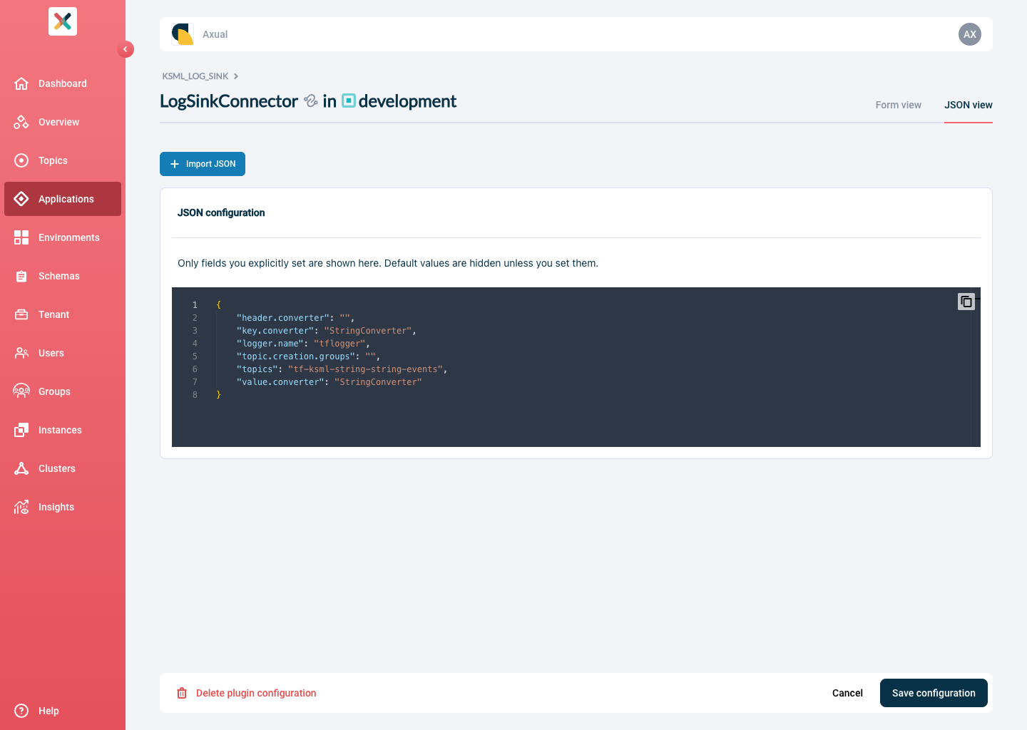 Axual "Self-Service" UI, Plugin Configuration page showing the JSON view tab with a code editor displaying only the user-set properties